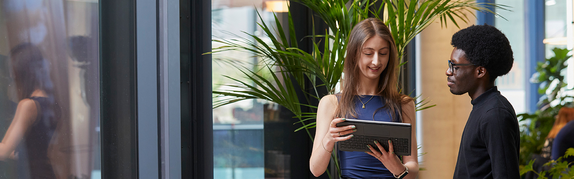 SMBC Employee on laptop in conference room
